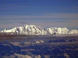 Tibet Kailash 12 Flying From Kathmandu 08 Annapurna Here is the wide south face of Annapurna I (8091m), the 10th highest mountain in the world. The 4000m south face was first climbed by Don Whillans and Dougal Haston in 1970 on Chris Bonington�s British Expedition, the first big Himalayan face to be climbed. The knob of rock to the left is called The Fang (7647m).